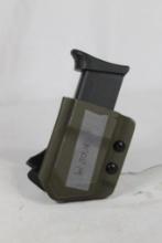 One polymer belt clip magazine holder with Glock Mod 19, 9mm magazine. Used in very nice condition.