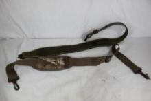 One leather cobra rifle sling and one padded nylon rifle sling.