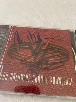 Signed Ted Nugent and Def Leppard CDs