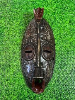 wood and metal African mask decor