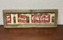 Long Wavy Coke Sign In Old Wooden Frame