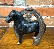 Vintage cast horse & horseshoe bank