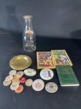 Assortment milk caps, pin buttons, books -see photo's-