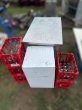 Bottles, crates and stainless steel table