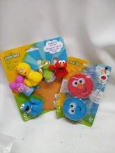 2Pc Sesame Street Lot- Glowing Bath Spinners, Finger Puppets