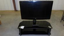 TV with stand, LG 42in with remote on glass and metal stand TV works