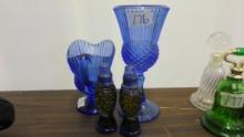 cobalt glass lot, avon salt and pepper shakers, and a cup and pitcher by conset
