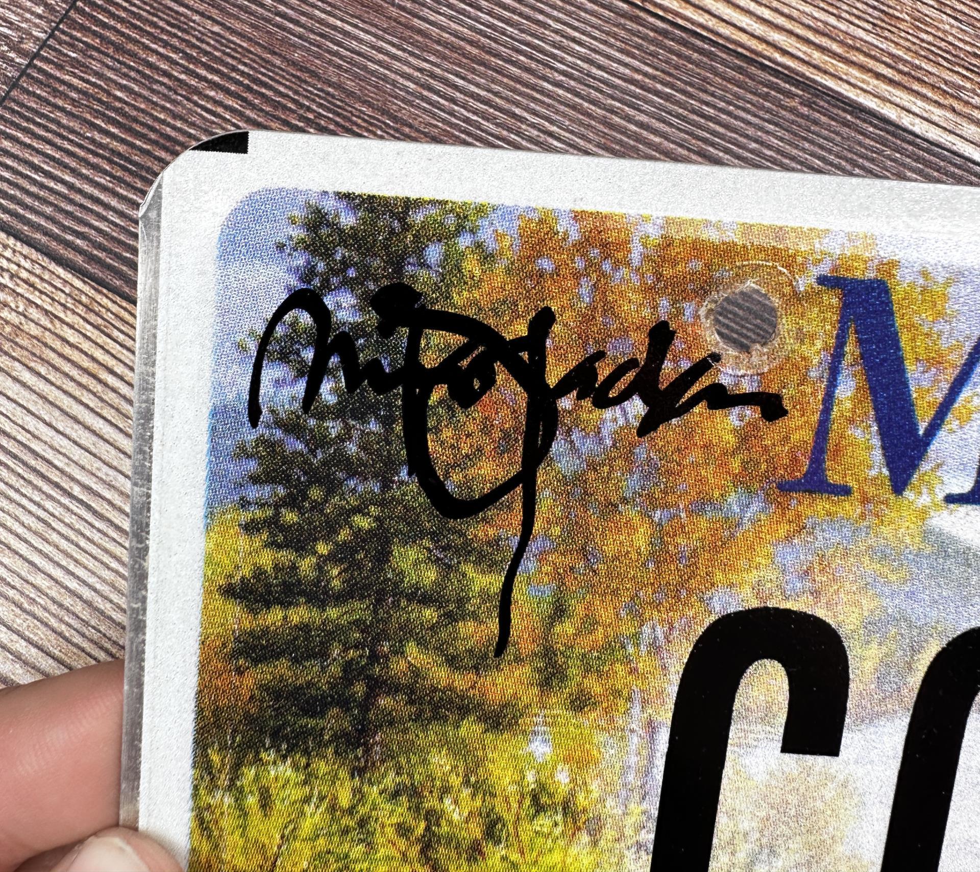 Monte Dolack Personal Autographed License Plate