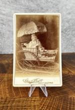 Baby in Fancy Buggy Cabinet Photo