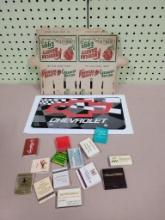 Matchbooks, egg crate and Chevrolet License Plate