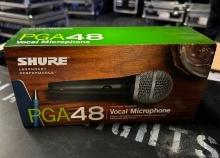SHURE PGA 48 VOCAL MICROPHONE WITH BOX AND HOLDER.