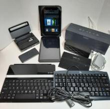 Amazon Kindle, Qlink Tablet (locked), Jawbone Speakers, Satechi Hub, Motorola Power Pak, Keyboards