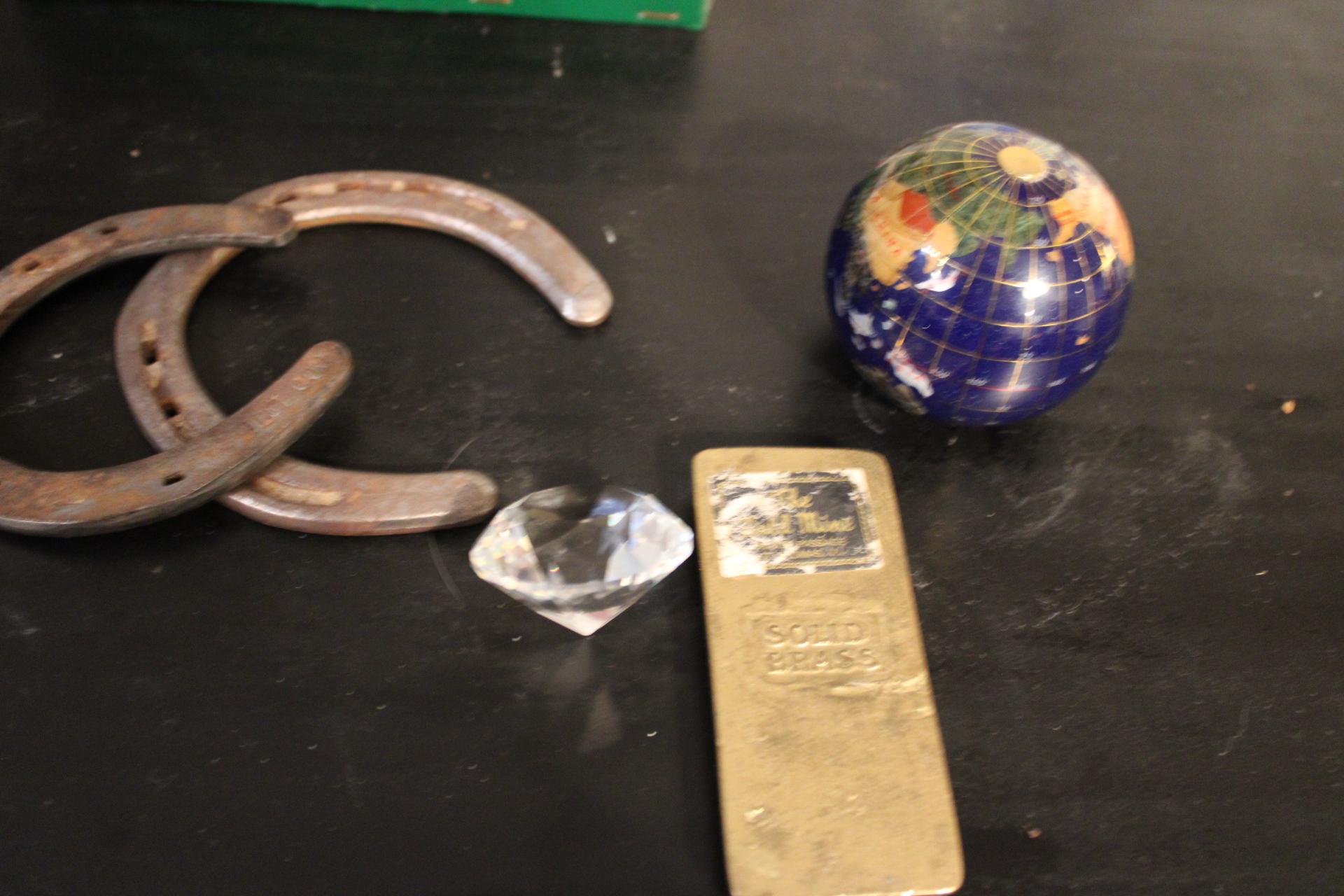 Paper Weights: Quartz globe, brass bar and glass and horse shoes