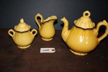 Tea pot with cream and sugar dishes