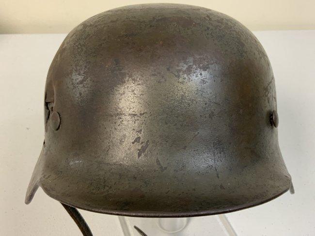 WWII GERMAN BATTLE DAMAGED M39 ARMY COMBAT HELMET WITH LINER AND CHIN STRAP