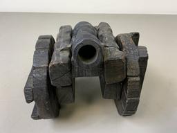 ANTIQUE MODEL OF A METAL CANNON WITH WOODEN MOUNT