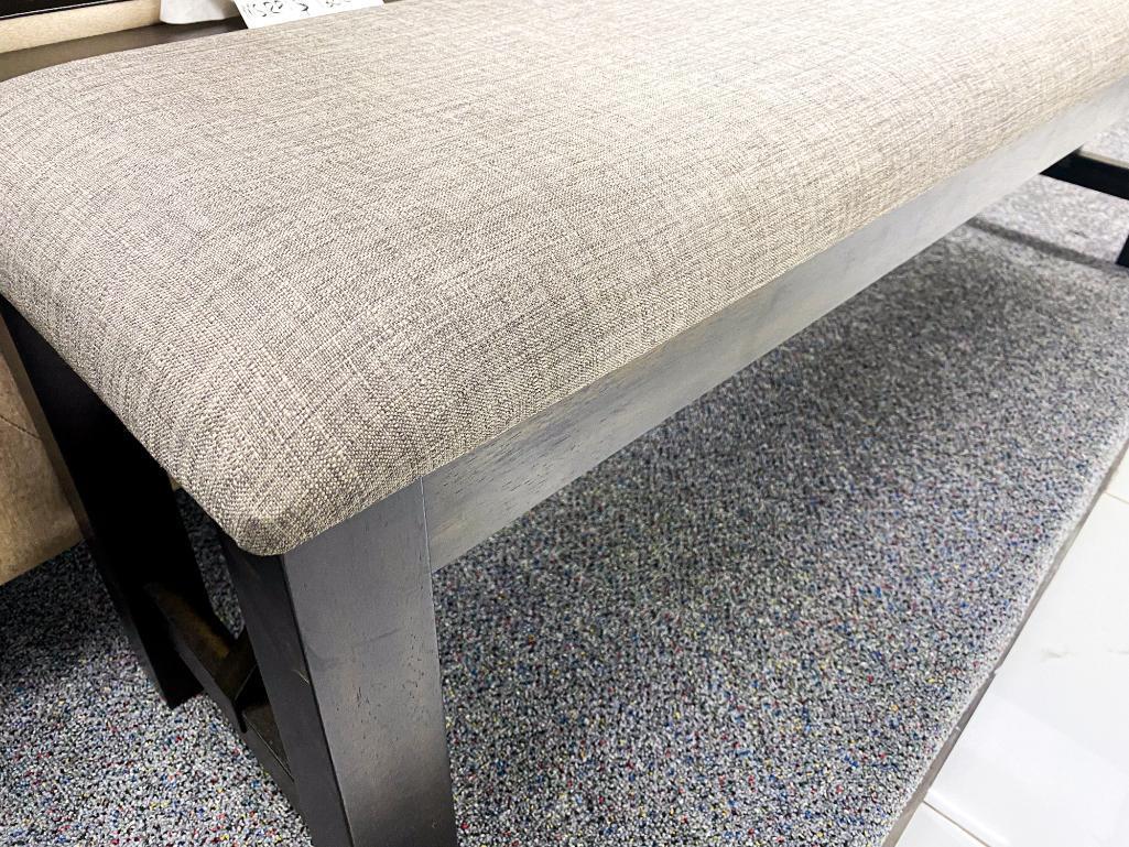 Grey cushioned bench