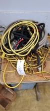 Extension cords, jumper cables, 2 water hoses,