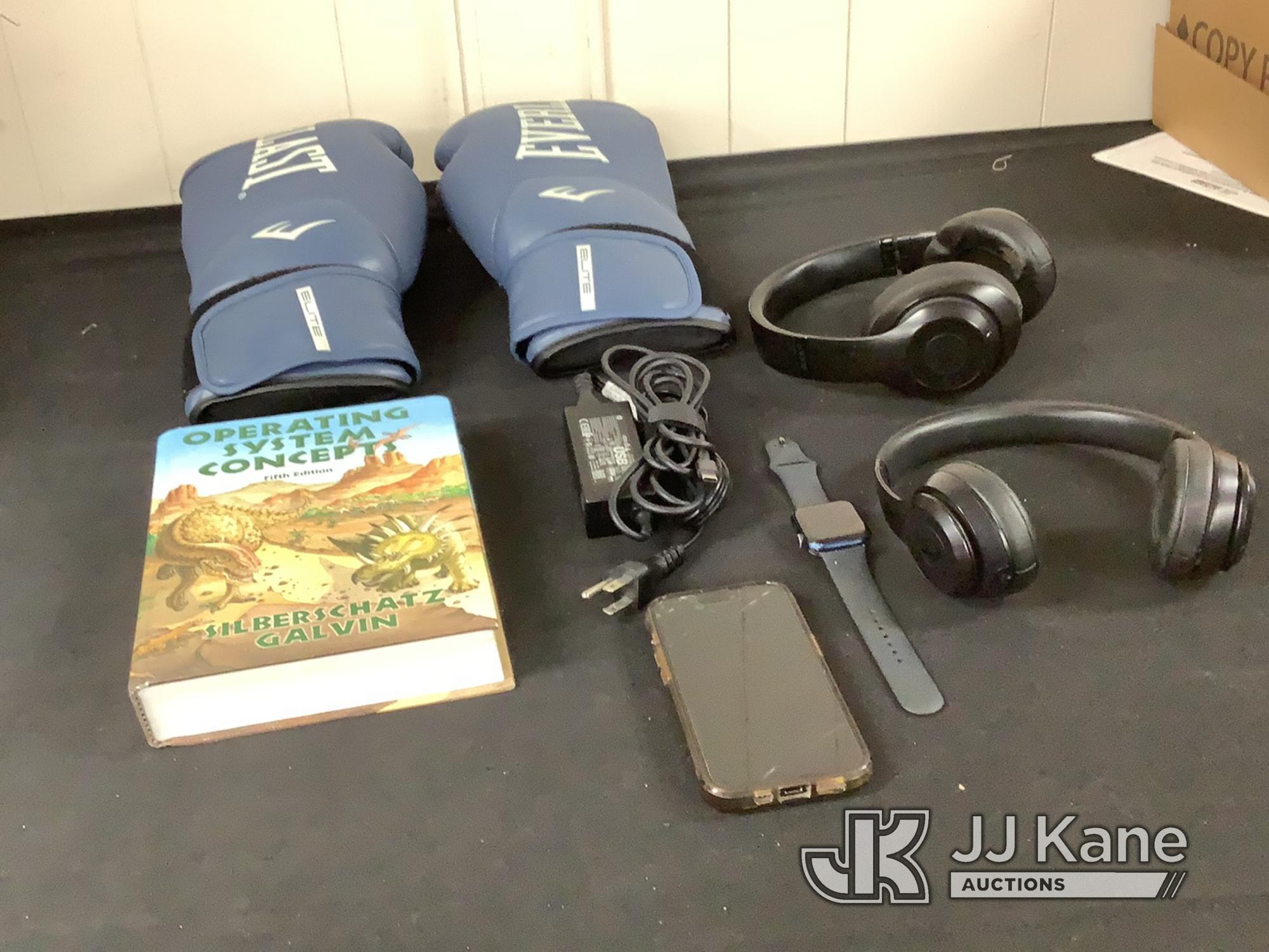 (Jurupa Valley, CA) Boxing gloves | headphones | iPhone possibly locked | book (Used) NOTE: This uni