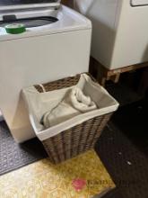 laundry basket and linens laundry room