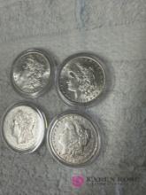 Group of four early silver dollars