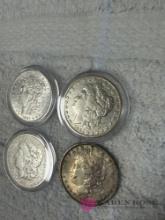 set of four vintage silver dollars