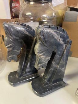 marble horse head book ends in basement