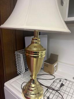 3- gold color house lamps in basement