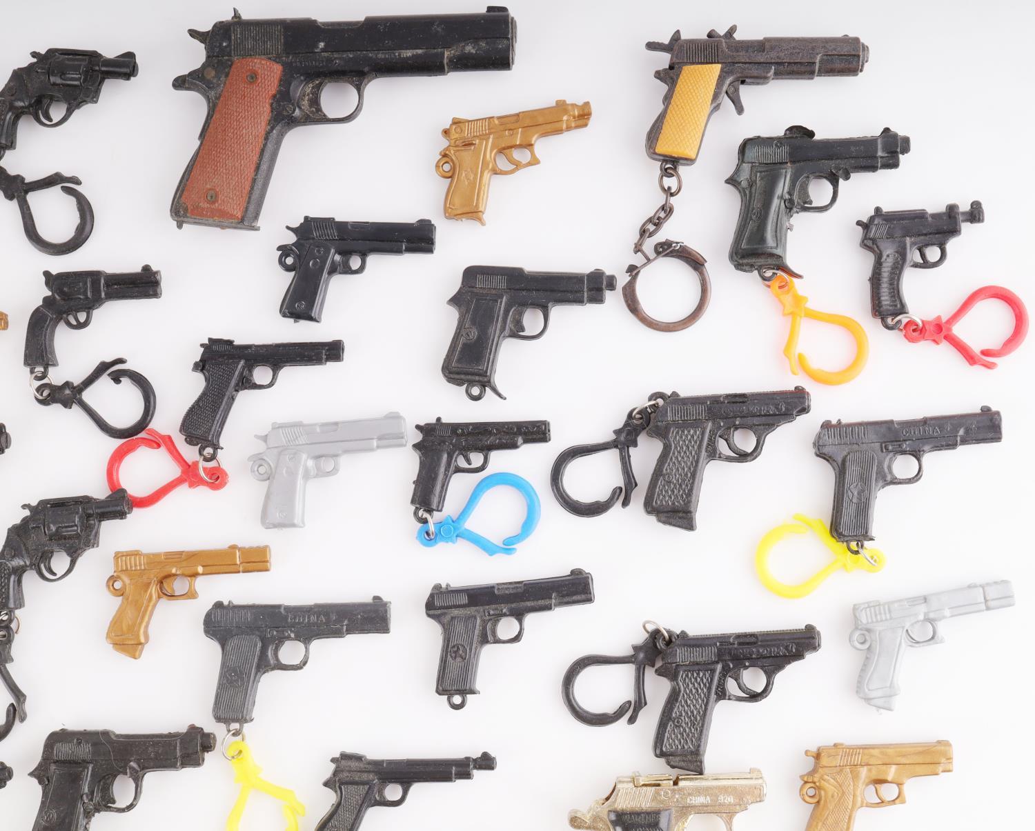LARGE COLLECTION OF MINIATURE TOY GUN LOT