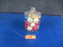 GLASS CANISTER OF CHRISTMAS ORNAMENTS