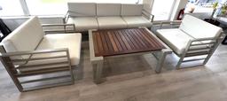 Sunset, a 4 Piece Outdoor Patio Furniture Set with a 3 Seater Sofa, (2) Side Chairs and a Teak Top C