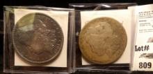 1894 O Good & 1904 P Morgan Dollar in EF condition with steel blue toning.