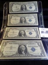 (4) Series 1957B One Dollar U.S. Silver Certificates. Stored in a plastic page.