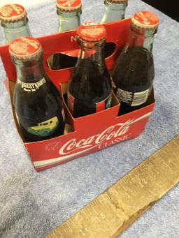 vintage six piece, Coca-Cola glass bottles with carrying case, miscellaneous advertisements
