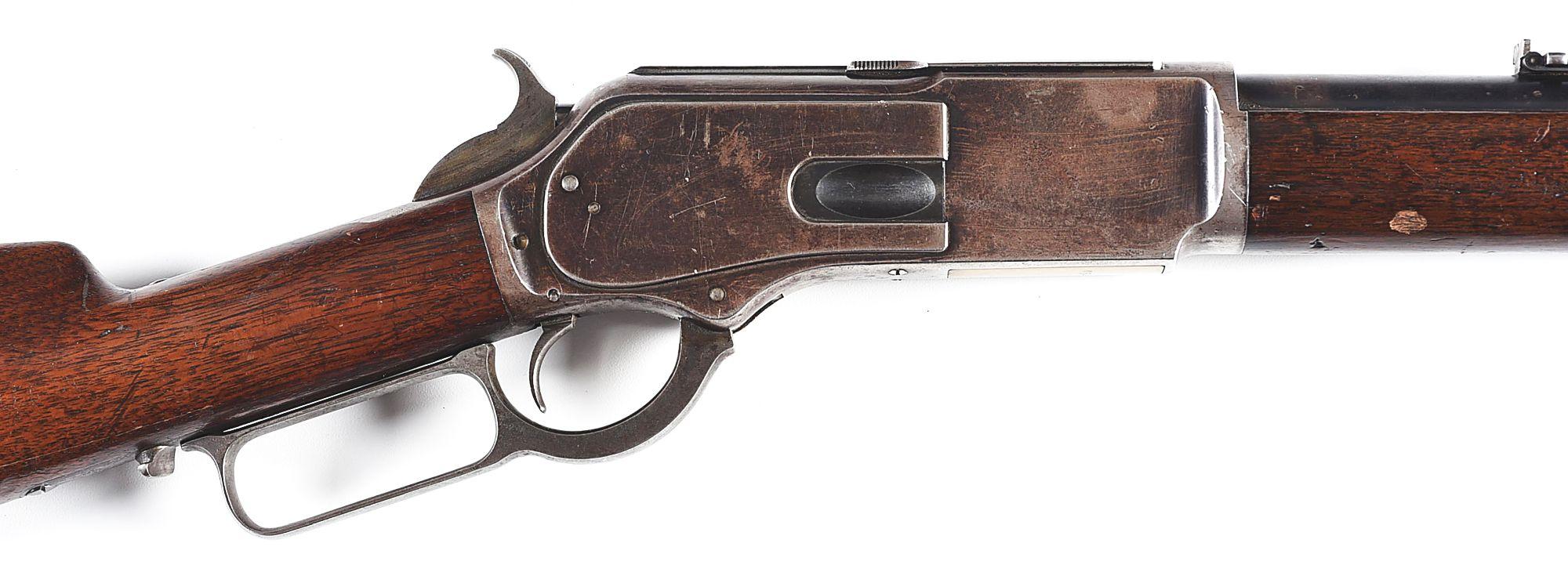 (A) WINCHESTER MODEL 1876 LEVER ACTION RIFLE.