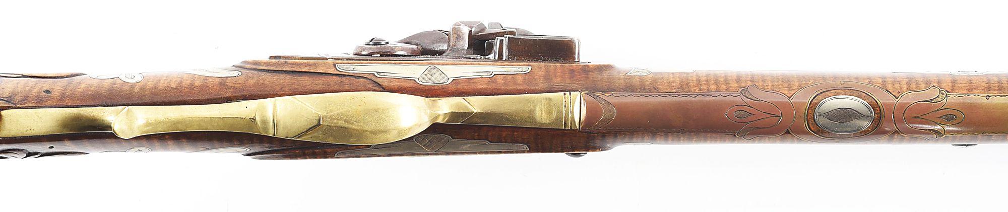 (A) WILLIAM BUCHELE SIGNED KENTUCKY RIFLE WITH RELIEF CARVED EAGLE WITH SILVER INLAYS.