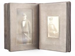 LOT OF 2: IMPERIAL GERMAN NAVAL OFFICER'S ALBUM AND MEDALS.