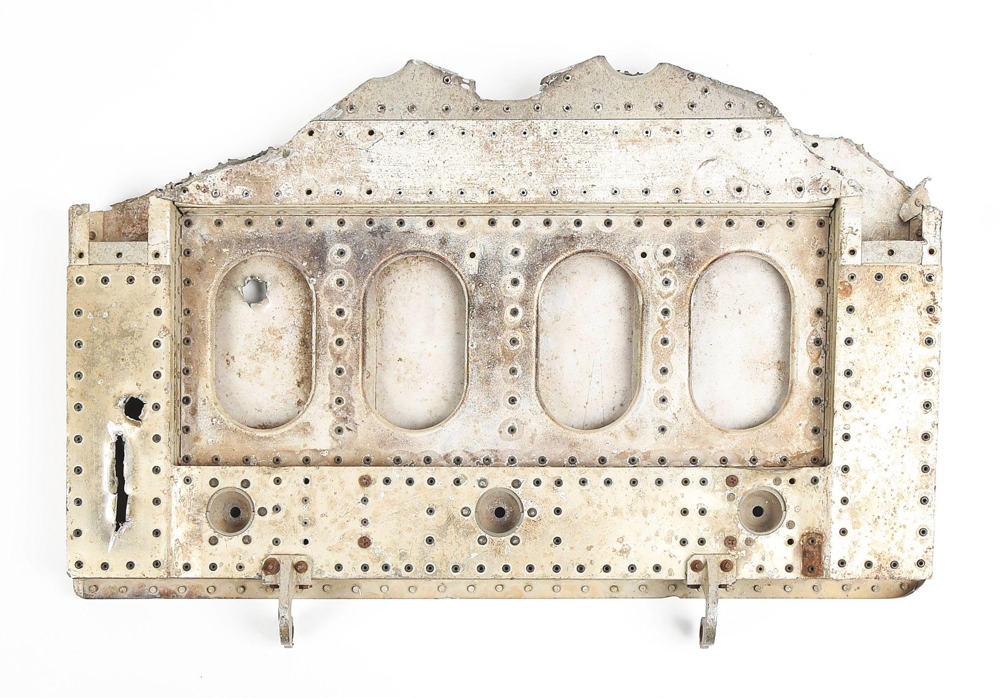 RECOVERED PANEL FROM A MESSERSCHMITT WITH BULLET HOLES.