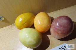 Four miniature alabaster/marble eggs