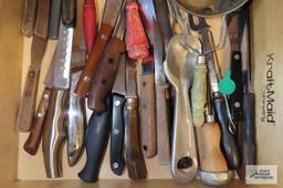 Drawer full of assorted knives. Sifters. Vintage ice cream scoop and Ice Ever pick