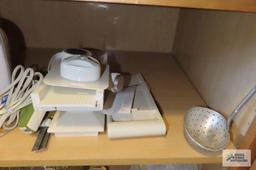 Cupboard lot of hand mixers and assorted mixing bowls