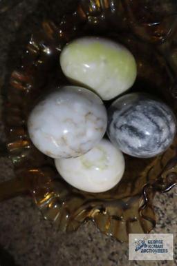 Amber glass fluted basket with marble/alabaster eggs