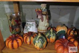 Fall decorations including ceramic pumpkins and candles