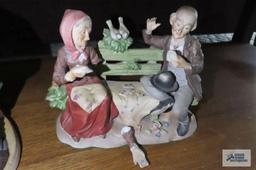 Three ceramic figurines. one is broken.
