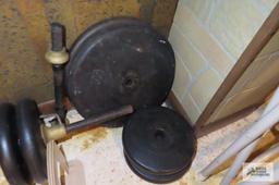 weight bar with weights in basement