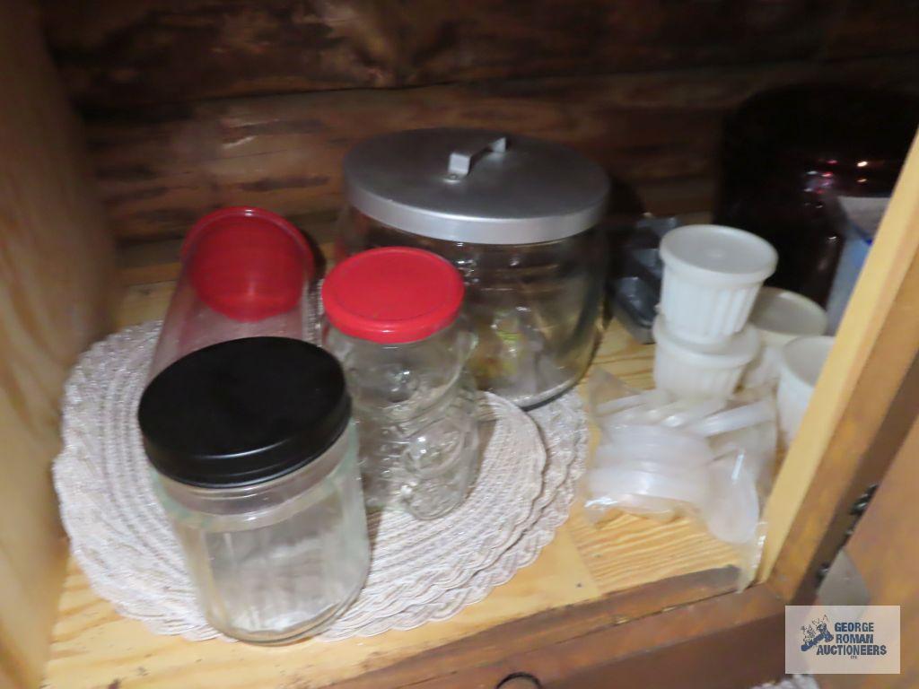 Assorted plastic ware storage containers and basket