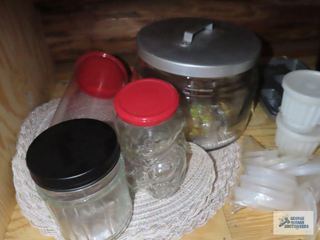 Assorted plastic ware storage containers and basket