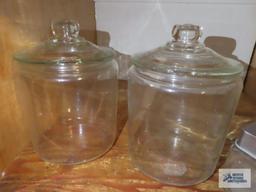 Glass cookie jars, square canister, and straw holder