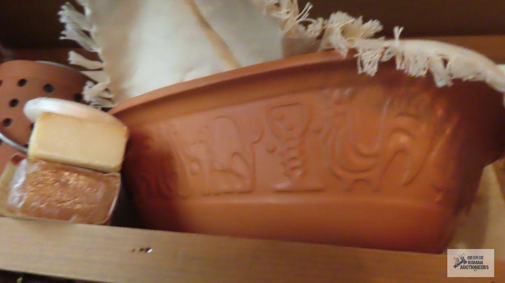 Terracotta baking dish, bath supplies and candle holder