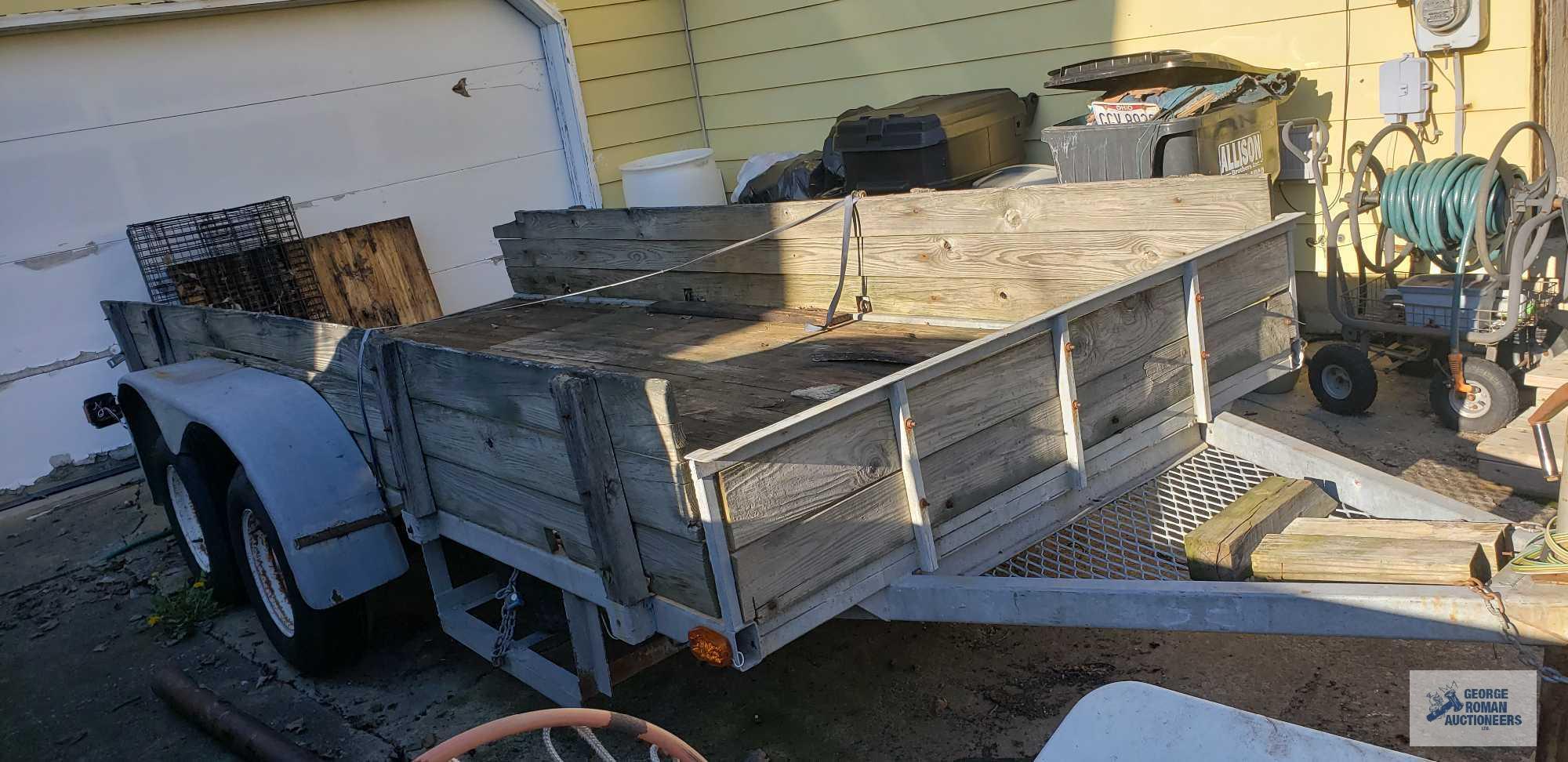 Galvanized shopmade utility trailer with dual 3500 lb axles, measures 14 ft by 5 ft 11 in. It takes
